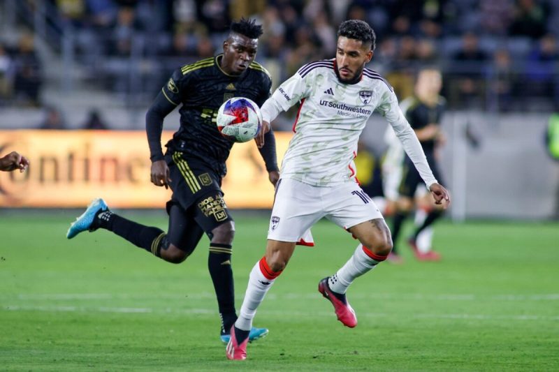 FC Dallas forward Jesus Ferreira (10) controls the ball away from Los Angeles FC defender Jesus David Murillo (3) during an MLS soccer match at BMO Stadium Saturday, March 25, 2023, in Los Angeles.
