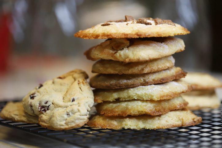 Stack of cookies on wire cooling rack on a table at a bakery
