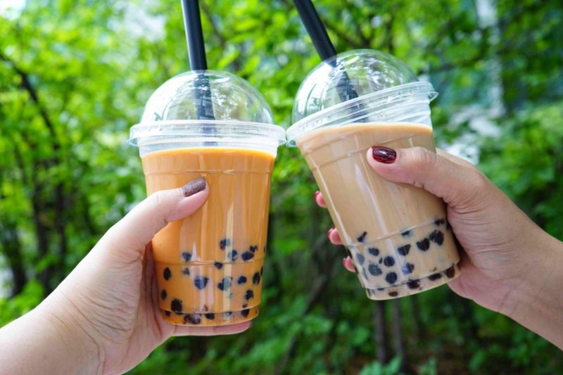 two hands toast with boba tea
