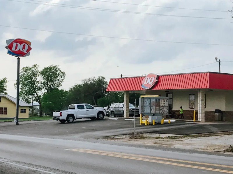 A white truck sits outside a Dairy Queen in rural Texas.
