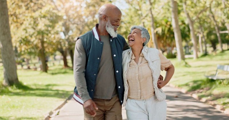 elderly couple smiling at each other