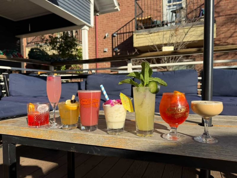 A lineup of mocktails for Dry January outside on a table.