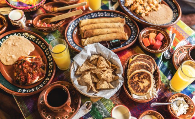 A table filled with delicious Hispanic foods purchased from a Hispanic market
