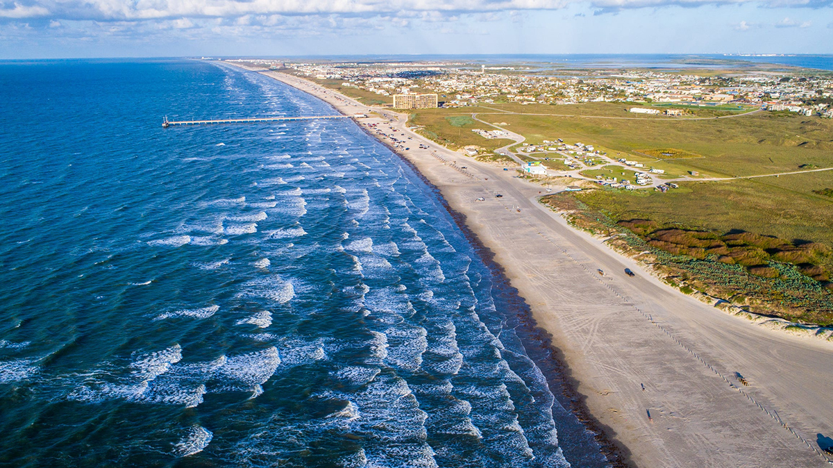 Sunrise on Padre Island from High Drone View with waves crashing along Beach such a paradise perfect summer escape.
