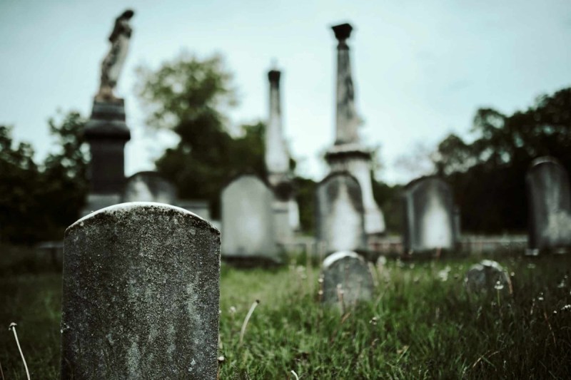 A close-up of a gravestone at historic Fretwell-New Trinity Cemetery