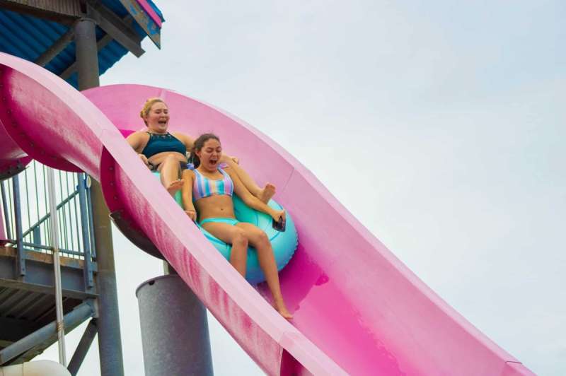 Thrilling adventures await at Hawaiian Falls, like this two-person Hawaiian Halfpipe slide, one of many water-based attractions in the Dallas-Fort Worth area