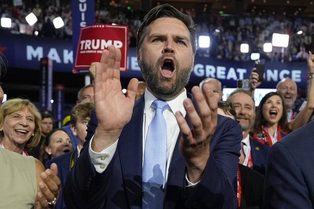 Republican vice presidential candidate Sen. JD Vance, R-Ohio, arrives on the floor during the first day of the 2024 Republican National Convention at the Fiserv Forum, Monday, July 15, 2024, in Milwaukee. (AP Photo/Carolyn Kaster)