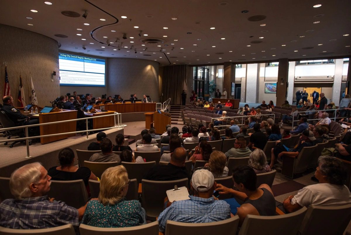 Crowd of people seated in an auditorium