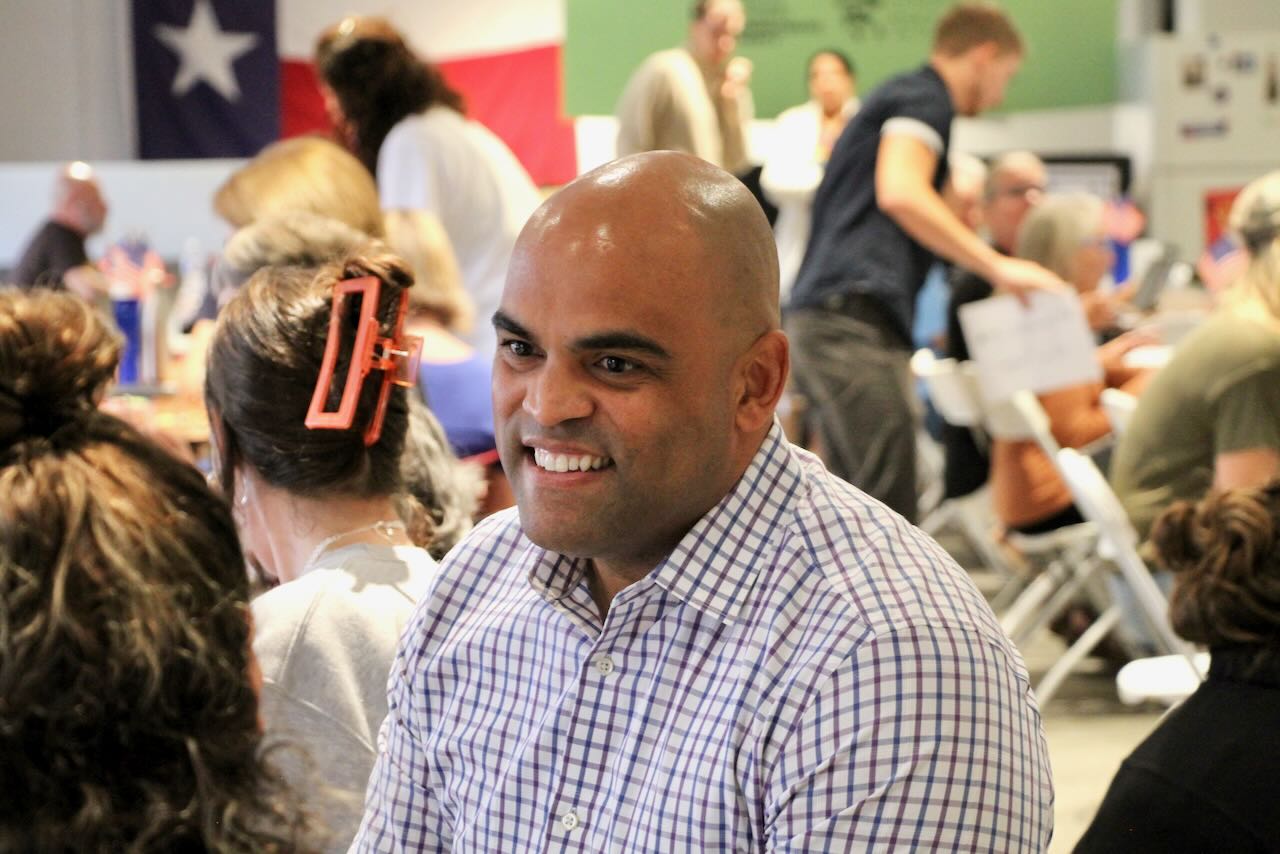 Colin Allred talks to people in Austin