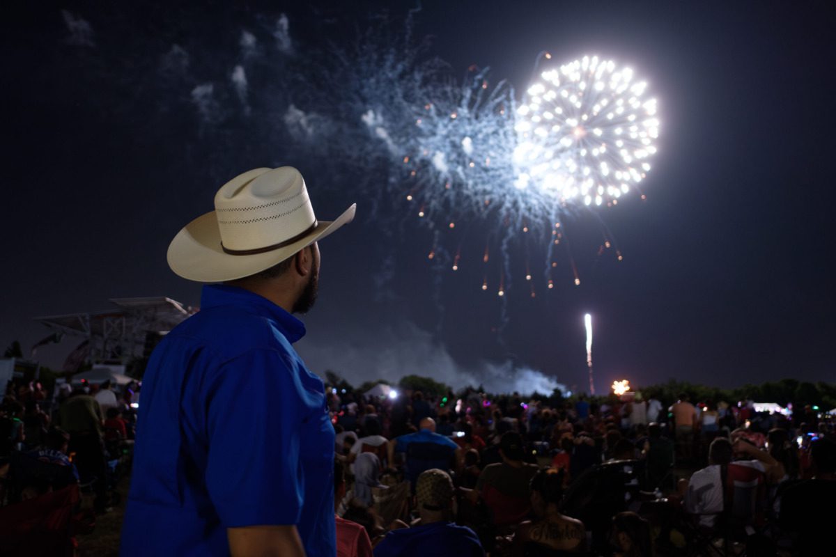 man watching fireworks in dfw