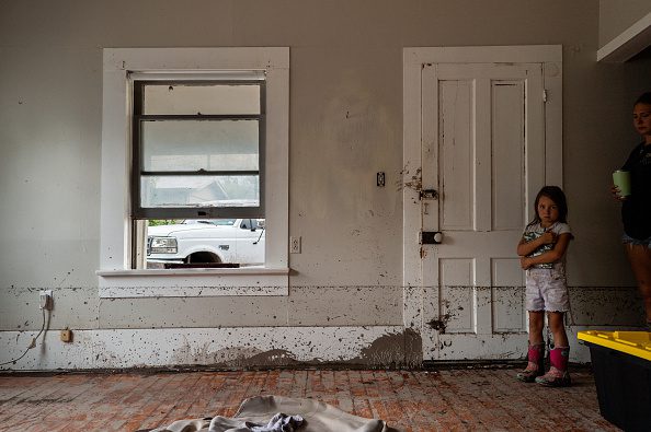 Child in flooded home after Texas Hill Country floods