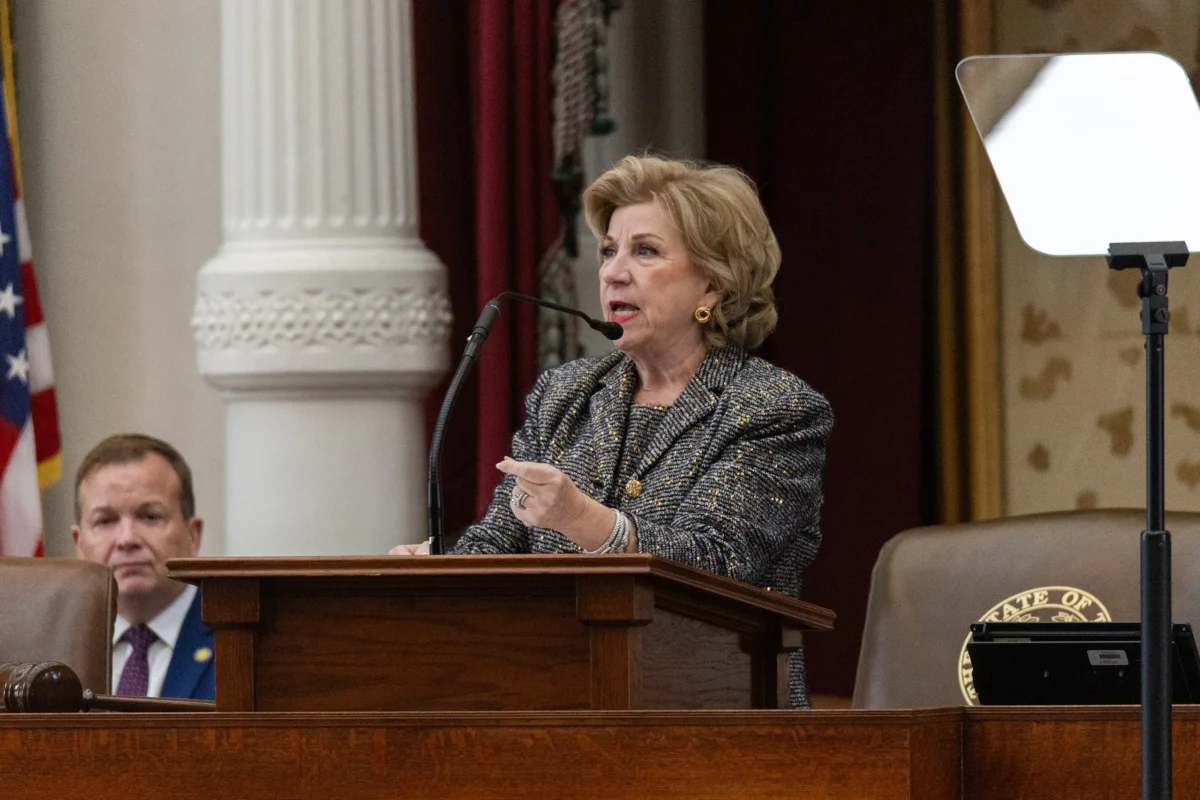Texas Secretary of State Jane Nelson speaking at a podium