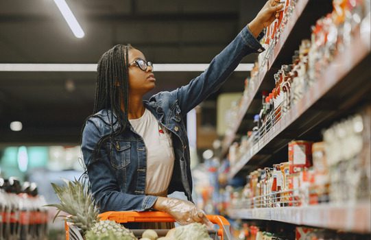 A woman shopping at a local grocery store